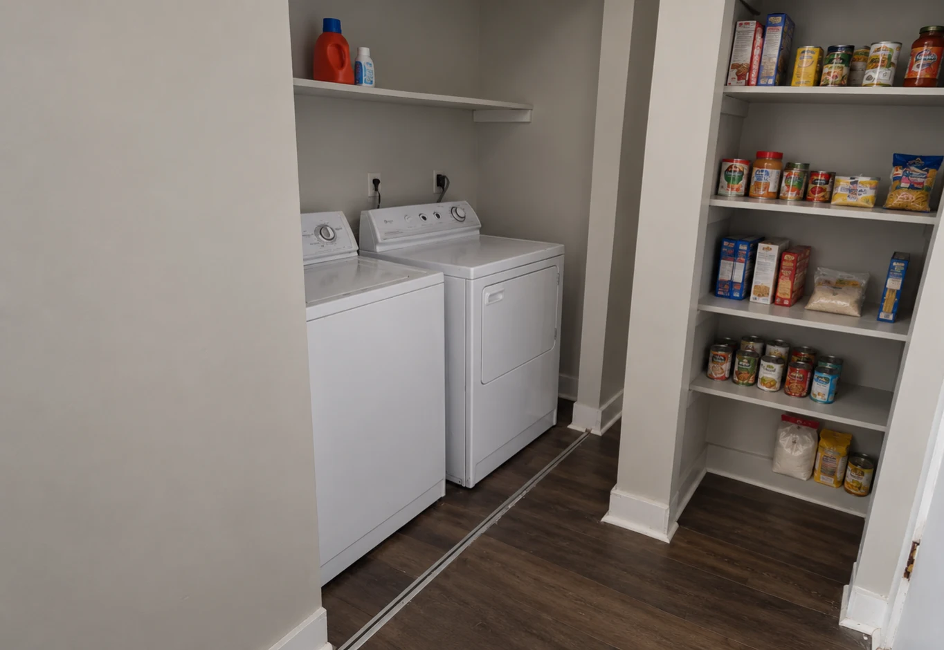 Laundry area with washer and dryer alongside household pantry shelving