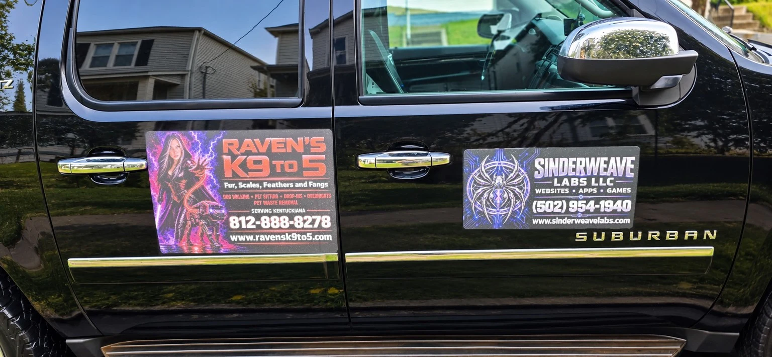 Raven's K9 to 5 and Sinderweave Labs magnetic signs displayed on a black Chevy Suburban