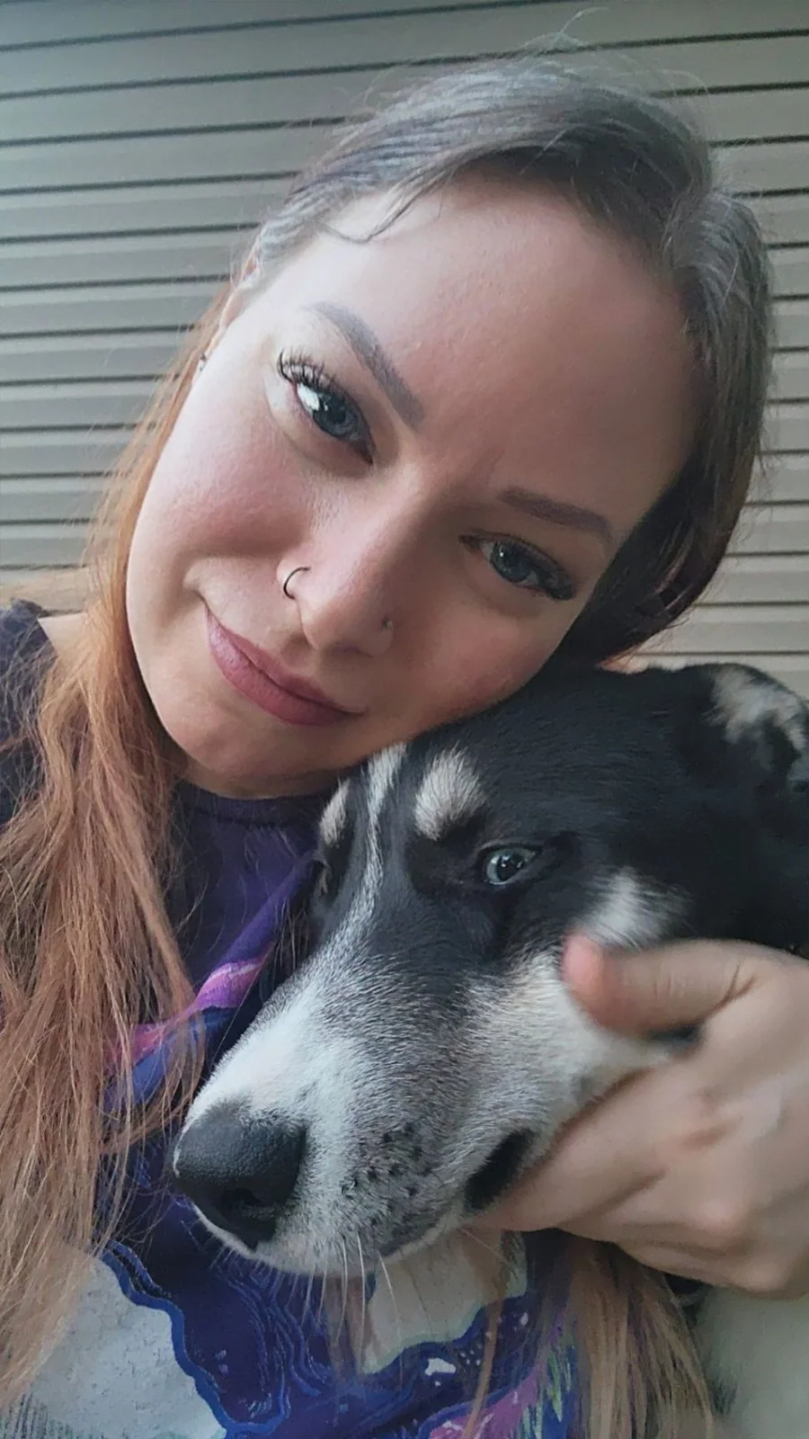 Raven providing calm, Fear Free companionship to a client’s dog